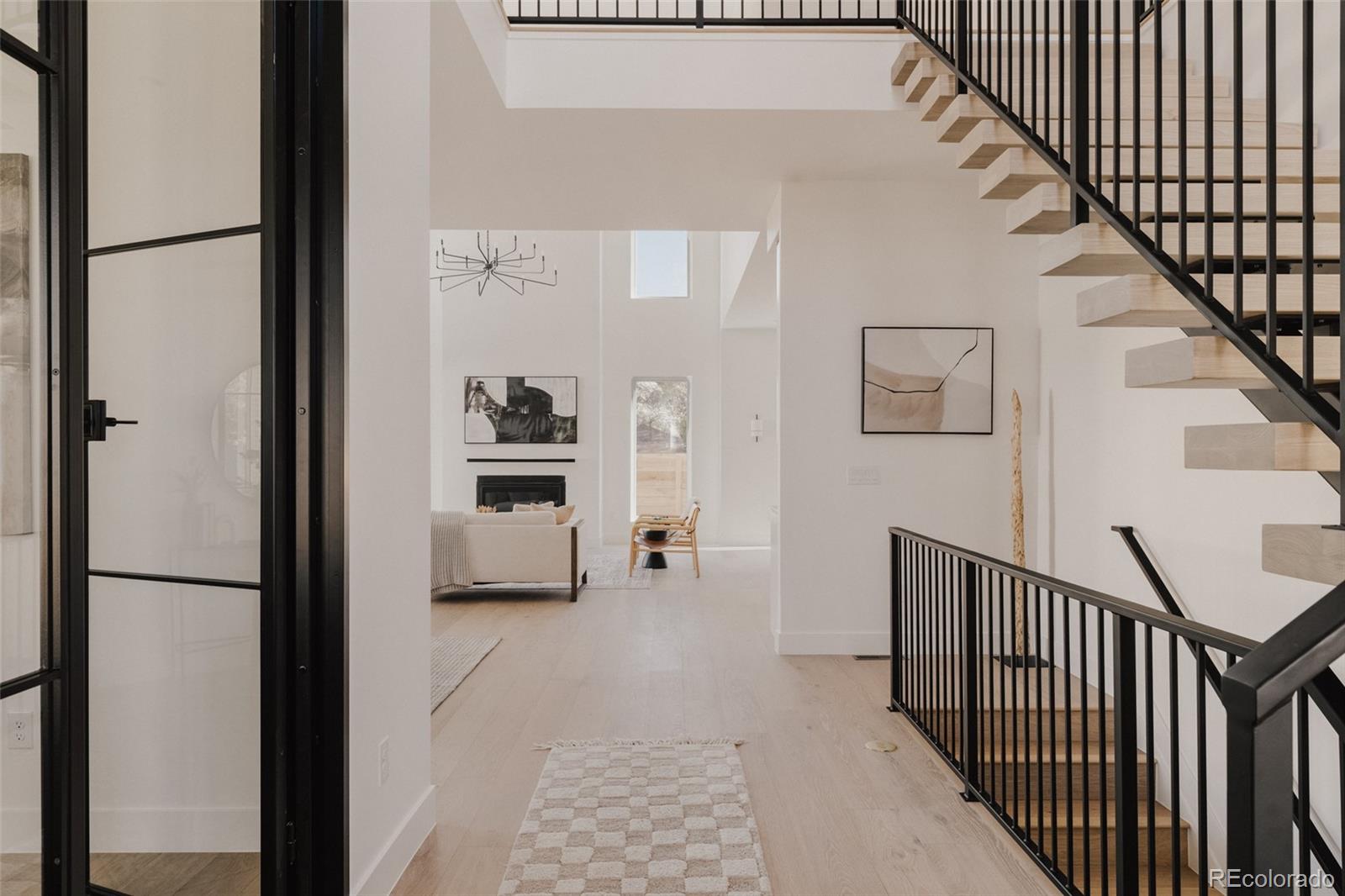 3530 Fenton Street Wheat Ridge, CO 80212 - Photo 3 of 44 a view of a hallway with wooden floor and entryway