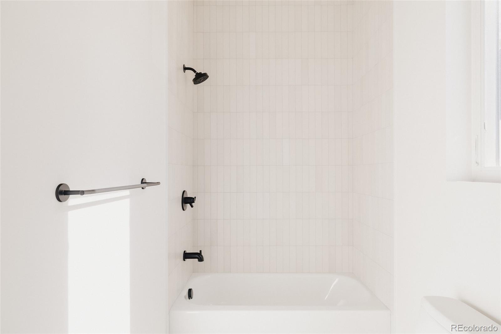 3530 Fenton Street Wheat Ridge, CO 80212 - Photo 34 of 44 a bathroom with a bathtub