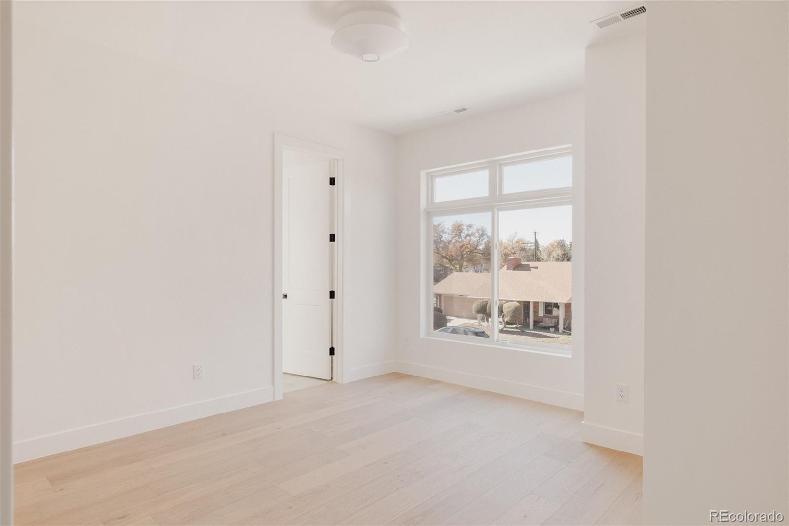 3530 Fenton Street Wheat Ridge, CO 80212 - Photo 35 of 44 a view of an empty room with a window