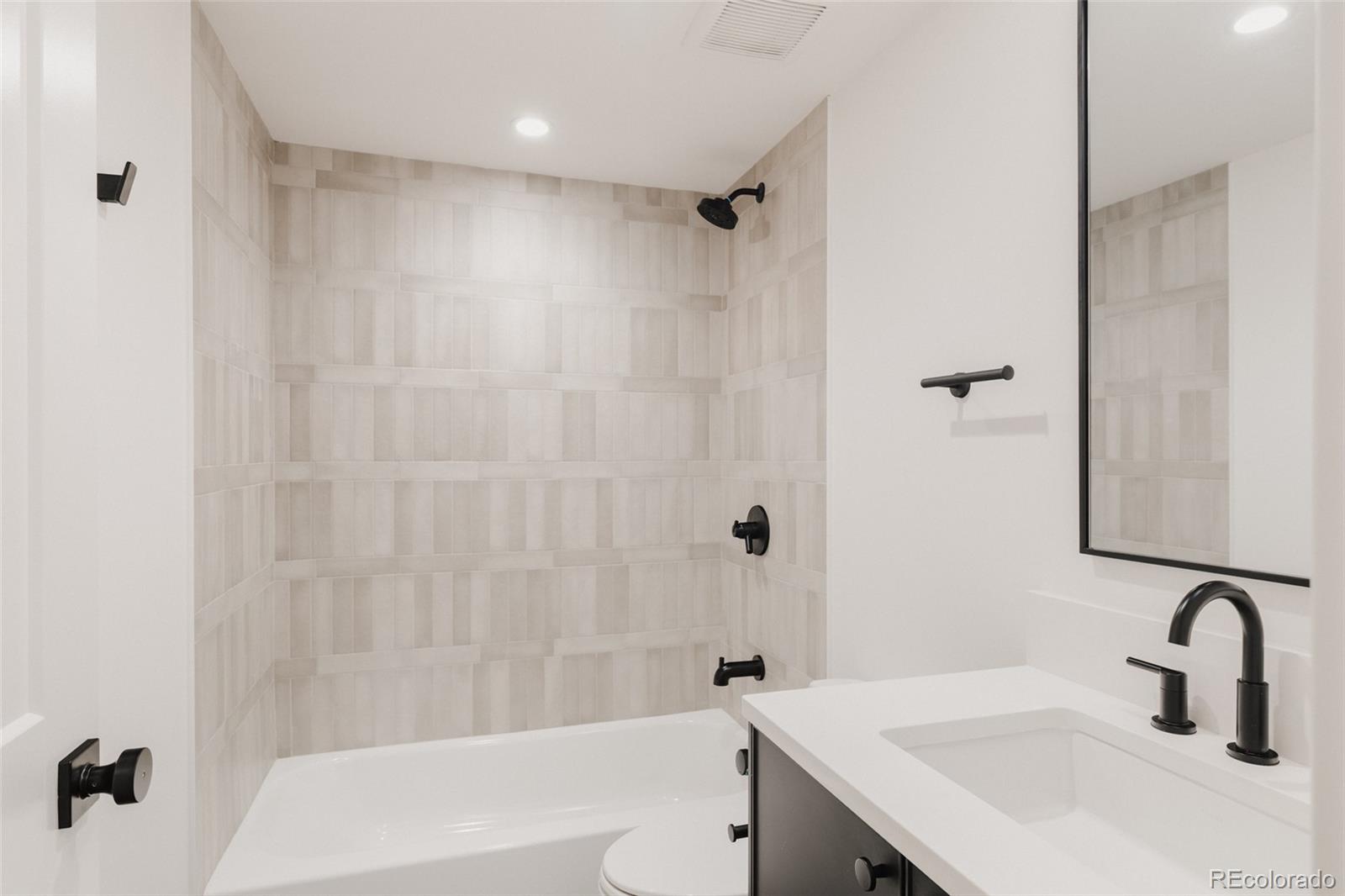 3530 Fenton Street Wheat Ridge, CO 80212 - Photo 38 of 44 a bathroom with a sink a toilet and shower