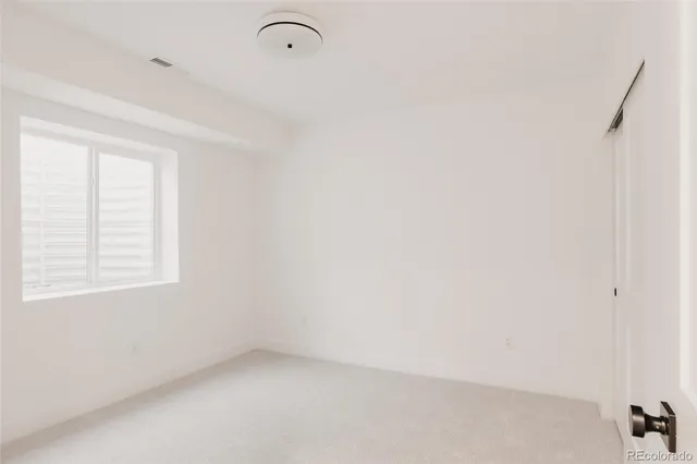a living room with hard wood floors