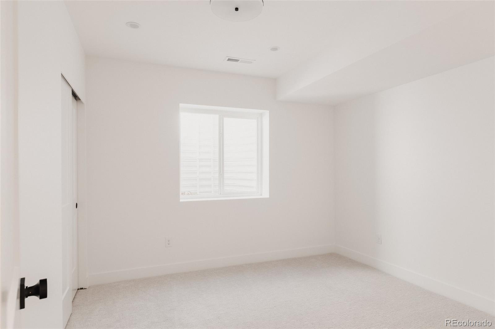 3530 Fenton Street Wheat Ridge, CO 80212 - Photo 40 of 44 an empty room with a window