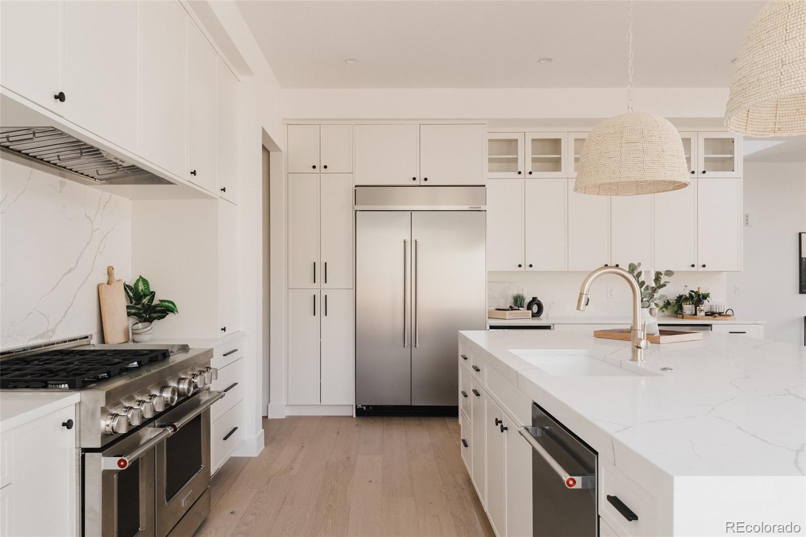 3530 Fenton Street Wheat Ridge, CO 80212 - Photo 5 of 44 a kitchen with stainless steel appliances granite countertop a sink stove and refrigerator