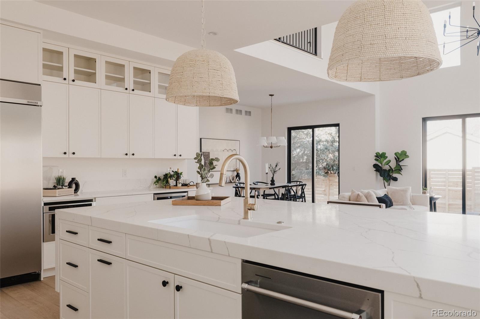 3530 Fenton Street Wheat Ridge, CO 80212 - Photo 7 of 44 a kitchen with sink a stove and cabinets