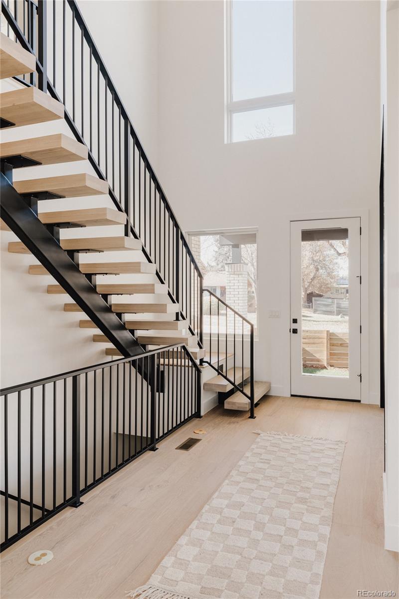 3530 Fenton Street Wheat Ridge, CO 80212 - Photo 8 of 44 a view of staircase with railing and a window