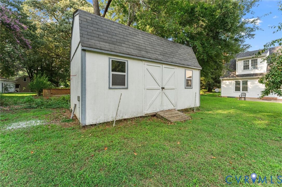 1760 Gloucester Road Gloucester Point, VA 23062 - Photo 46 of 52 Storage shed featuring a gabled roof, dual entry d