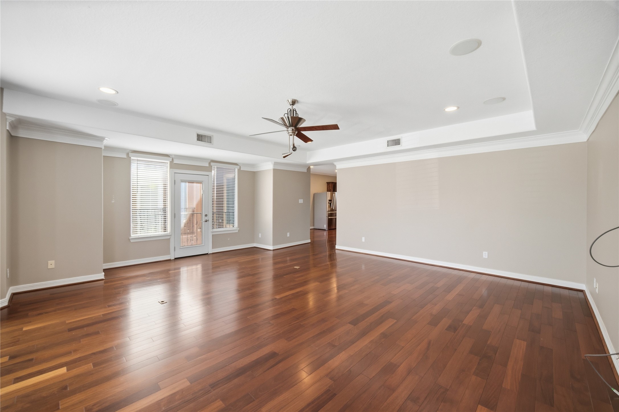 1316 Cleburne Street, Unit B Houston, TX 77004 - Photo 15 of 30 a view of an empty room with wooden floor and a window