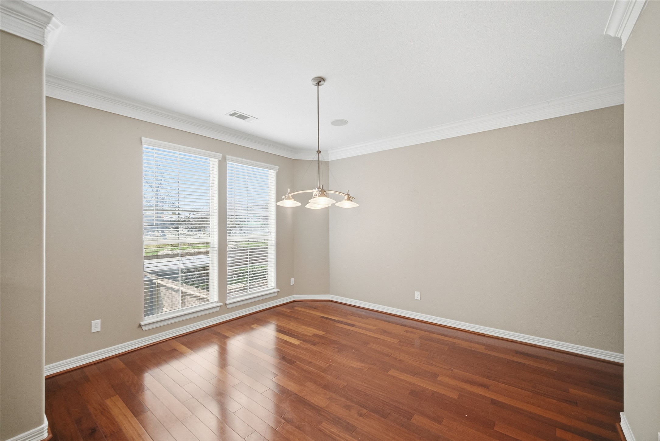 1316 Cleburne Street, Unit B Houston, TX 77004 - Photo 8 of 30 a view of an empty room with wooden floor and a window