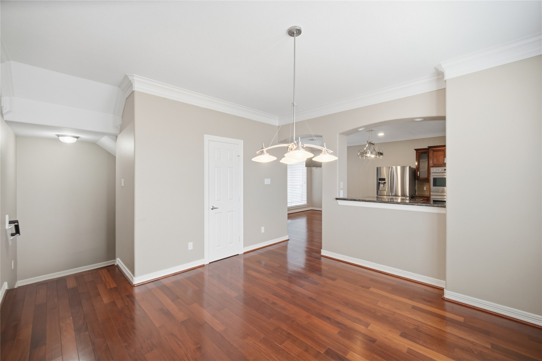 1316 Cleburne Street, Unit B Houston, TX 77004 - Photo 9 of 30 a view of a room with wooden floor and kitchen view