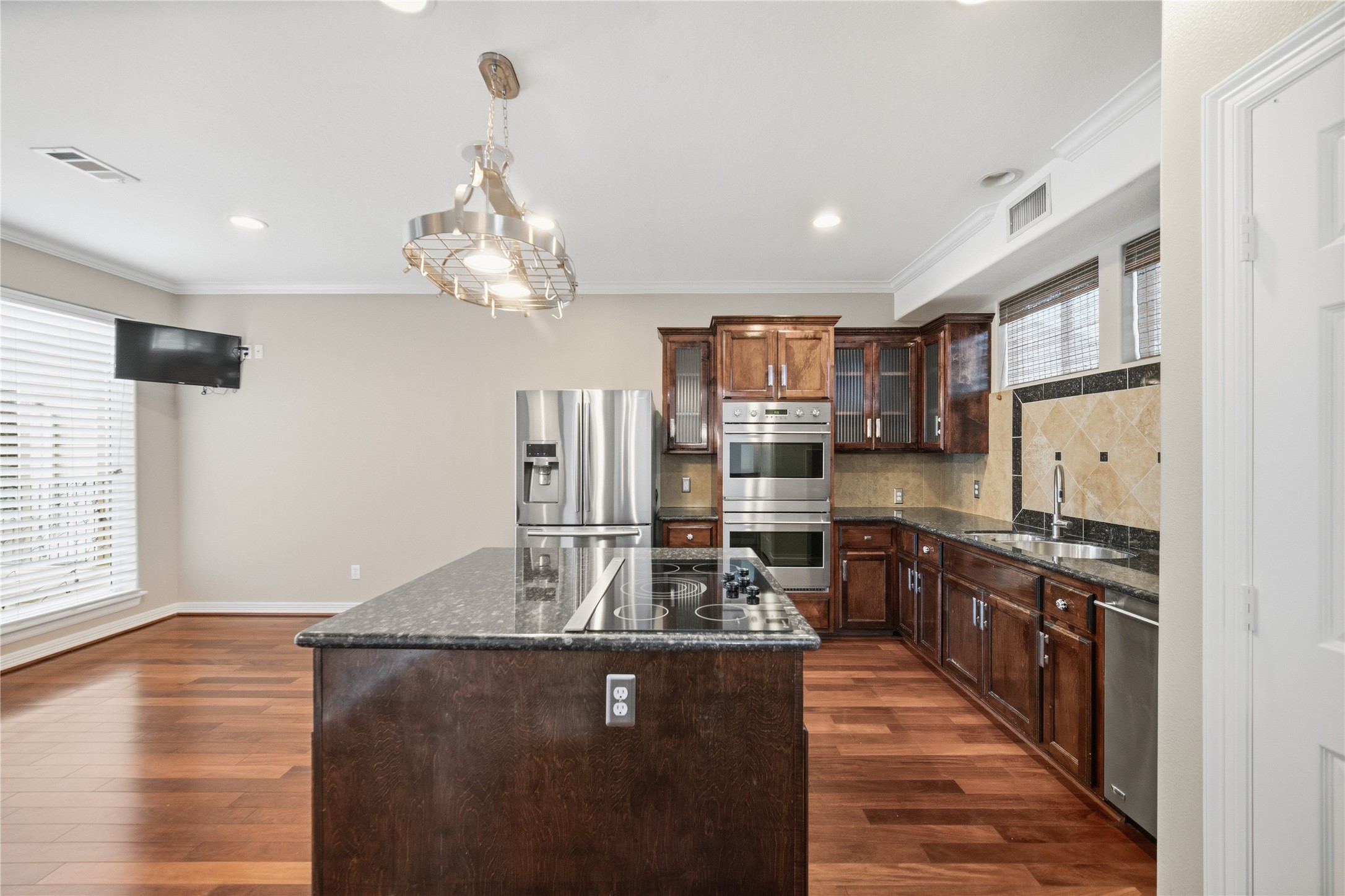 1316 Cleburne Street, Unit B Houston, TX 77004 - Photo 10 of 30 a kitchen with stainless steel appliances granite countertop a sink refrigerator stove and oven
