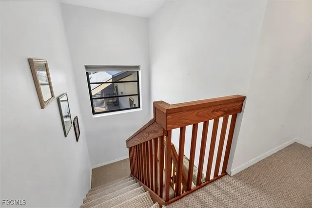 a view of entryway with stairs and wooden floor