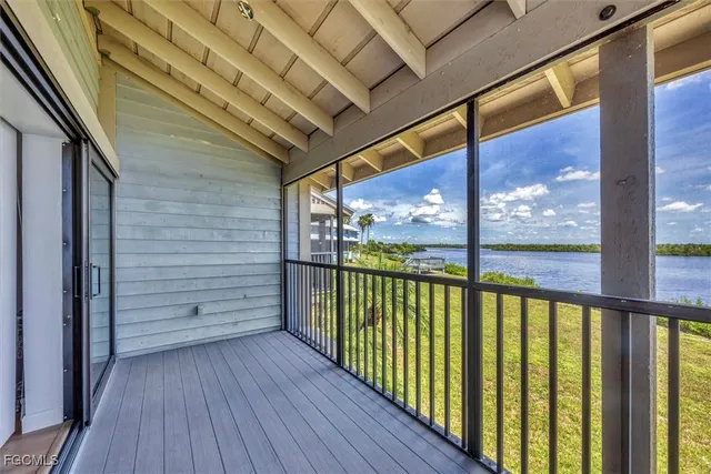 a view of a balcony with wooden floor