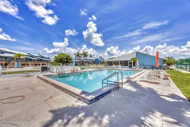 a view of a swimming pool with a patio