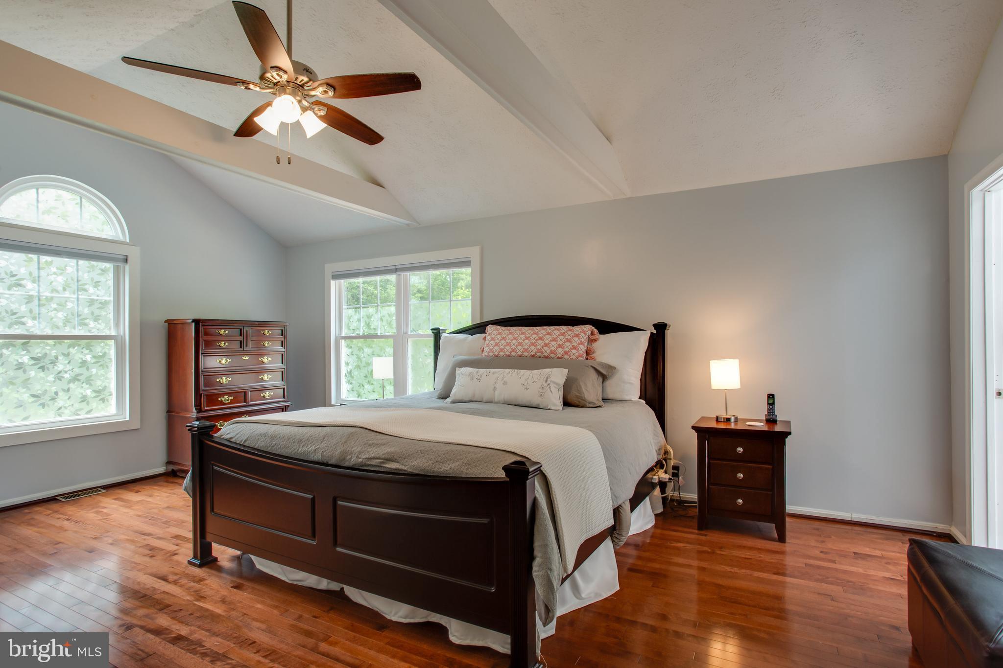 2904 Eutaw Forest Drive Waldorf, MD 20603 - Photo 12 of 59 a bedroom with a bed and a chandelier