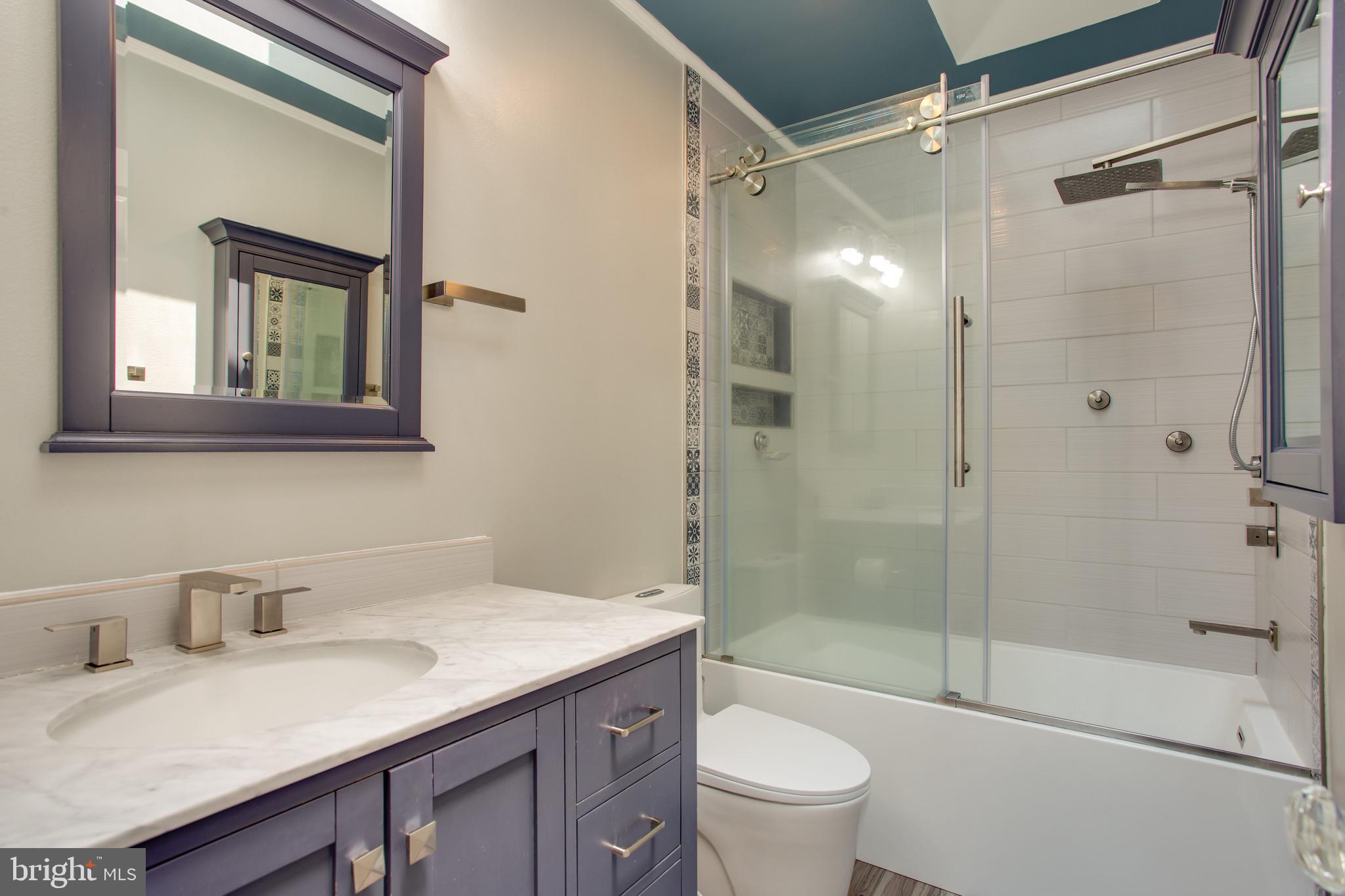 2904 Eutaw Forest Drive Waldorf, MD 20603 - Photo 17 of 59 a bathroom with a granite countertop sink toilet and shower