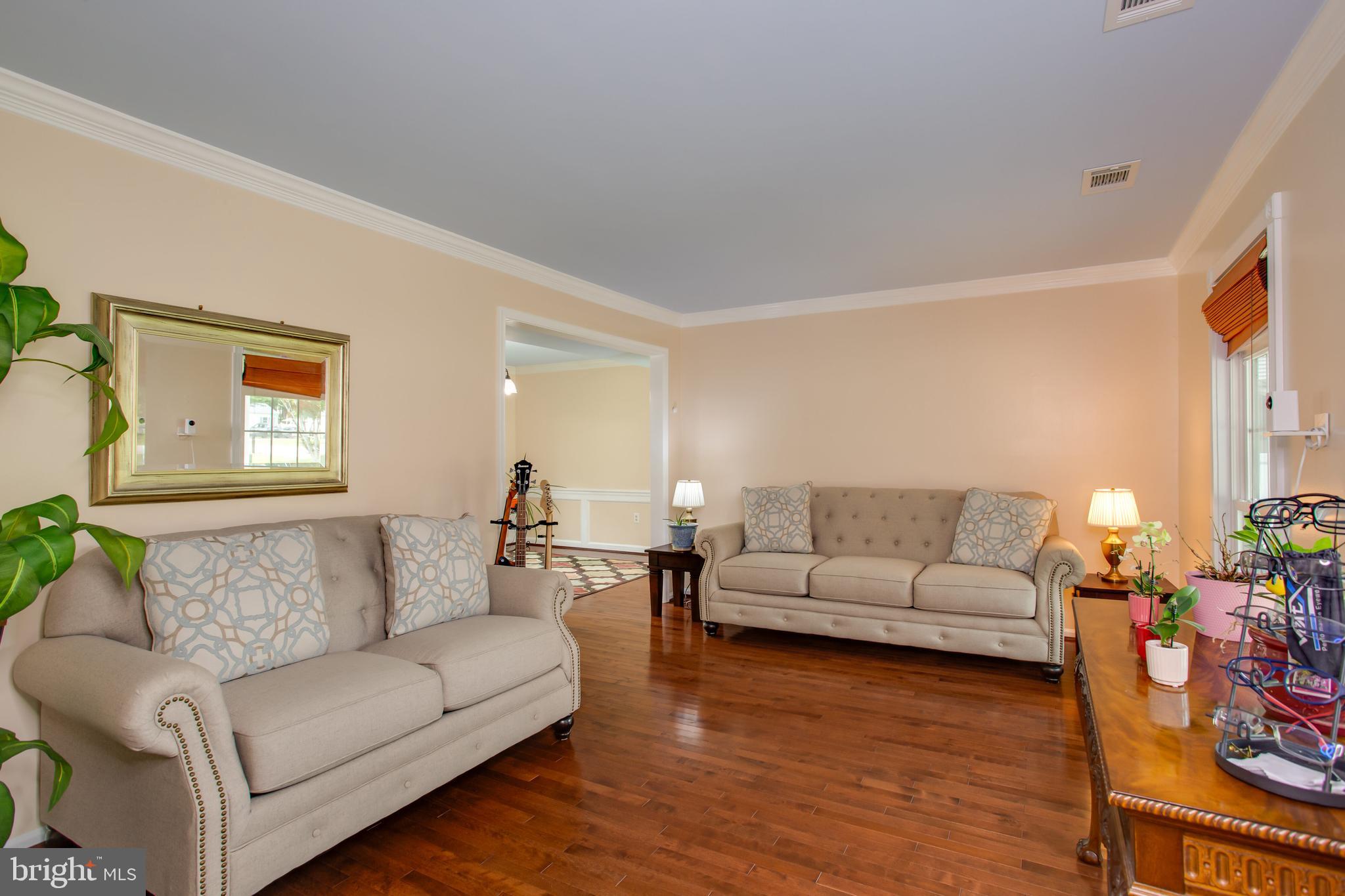2904 Eutaw Forest Drive Waldorf, MD 20603 - Photo 20 of 59 a living room with furniture and a wooden floor