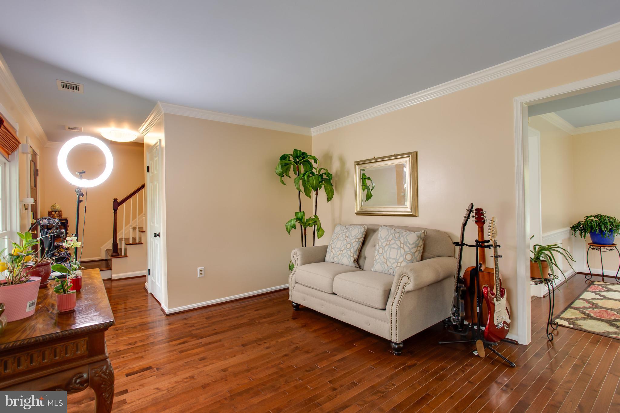 2904 Eutaw Forest Drive Waldorf, MD 20603 - Photo 21 of 59 a living room with furniture and a wooden floor