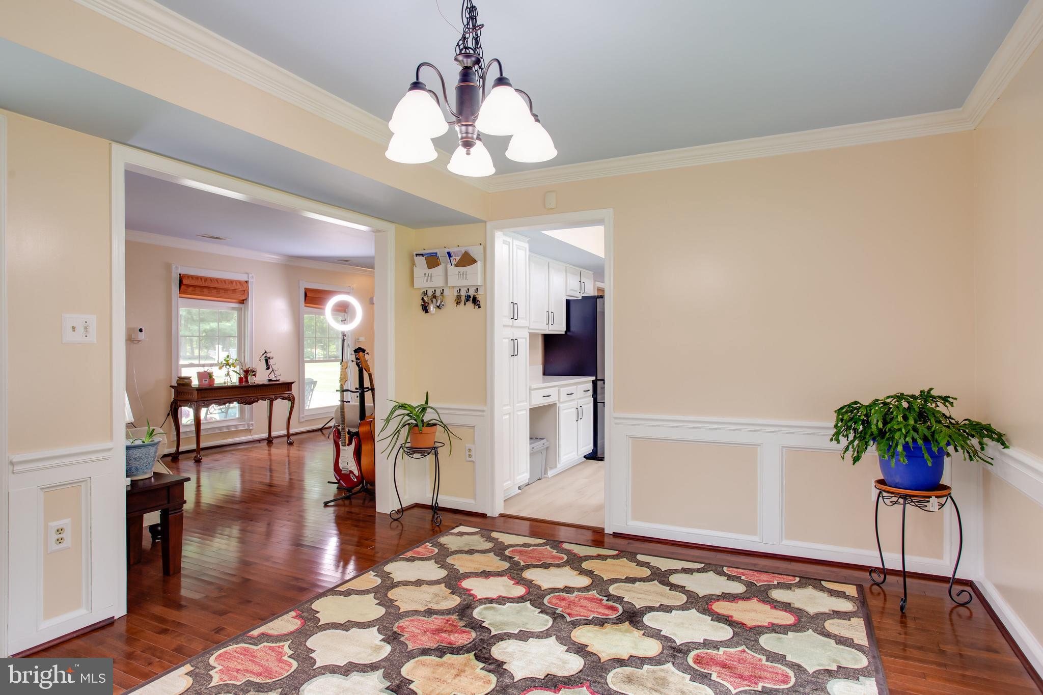 2904 Eutaw Forest Drive Waldorf, MD 20603 - Photo 24 of 59 a living room with furniture and a chandelier