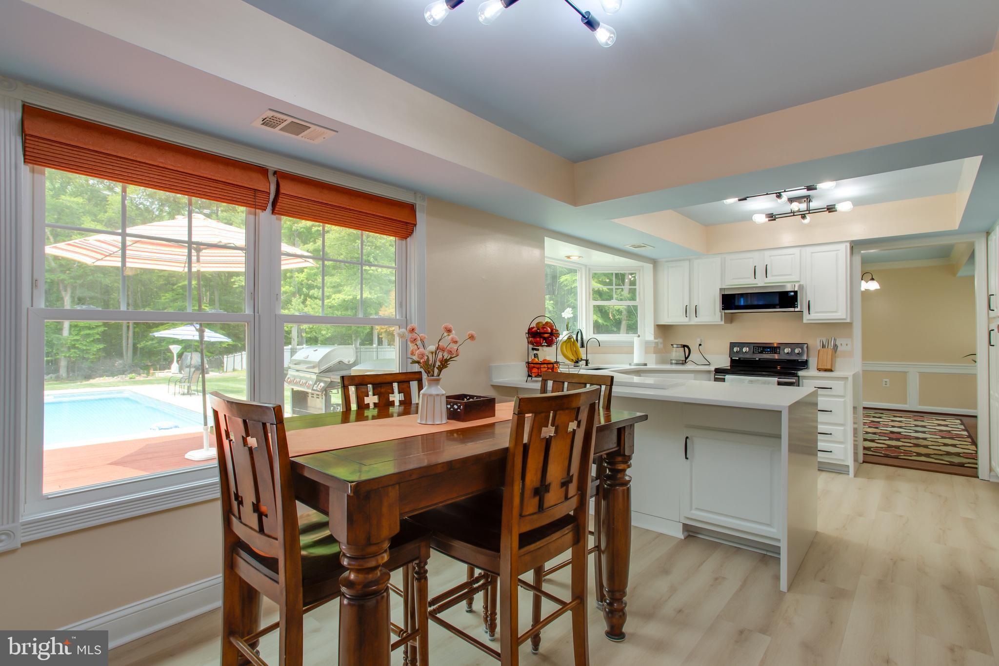 2904 Eutaw Forest Drive Waldorf, MD 20603 - Photo 28 of 59 a view of a dining room with furniture window and wooden floor