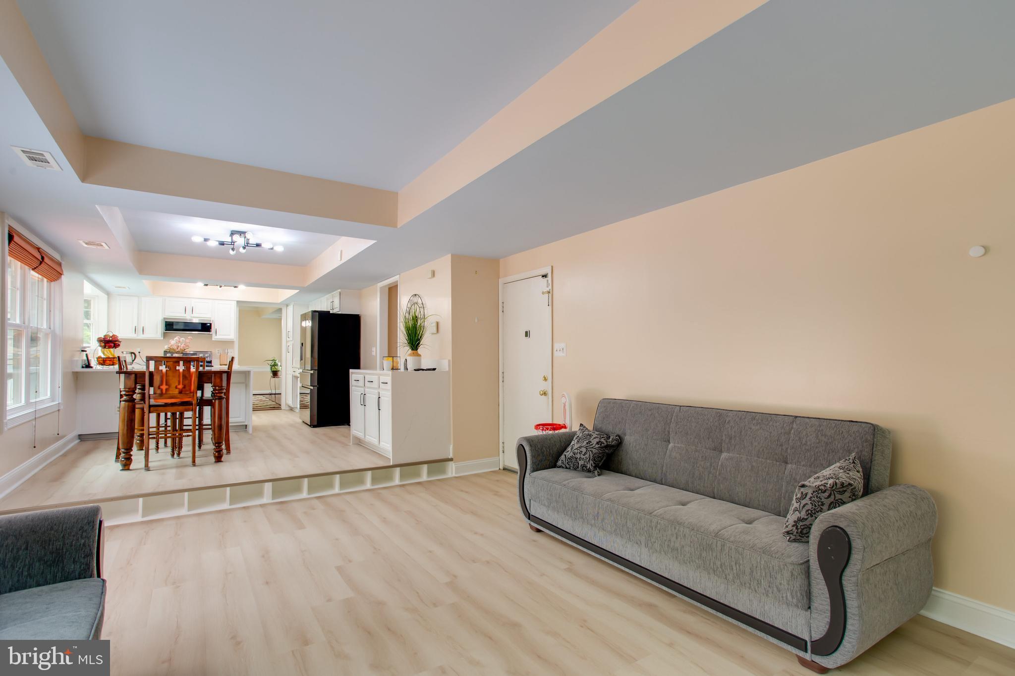 2904 Eutaw Forest Drive Waldorf, MD 20603 - Photo 30 of 59 a living room with furniture and kitchen view