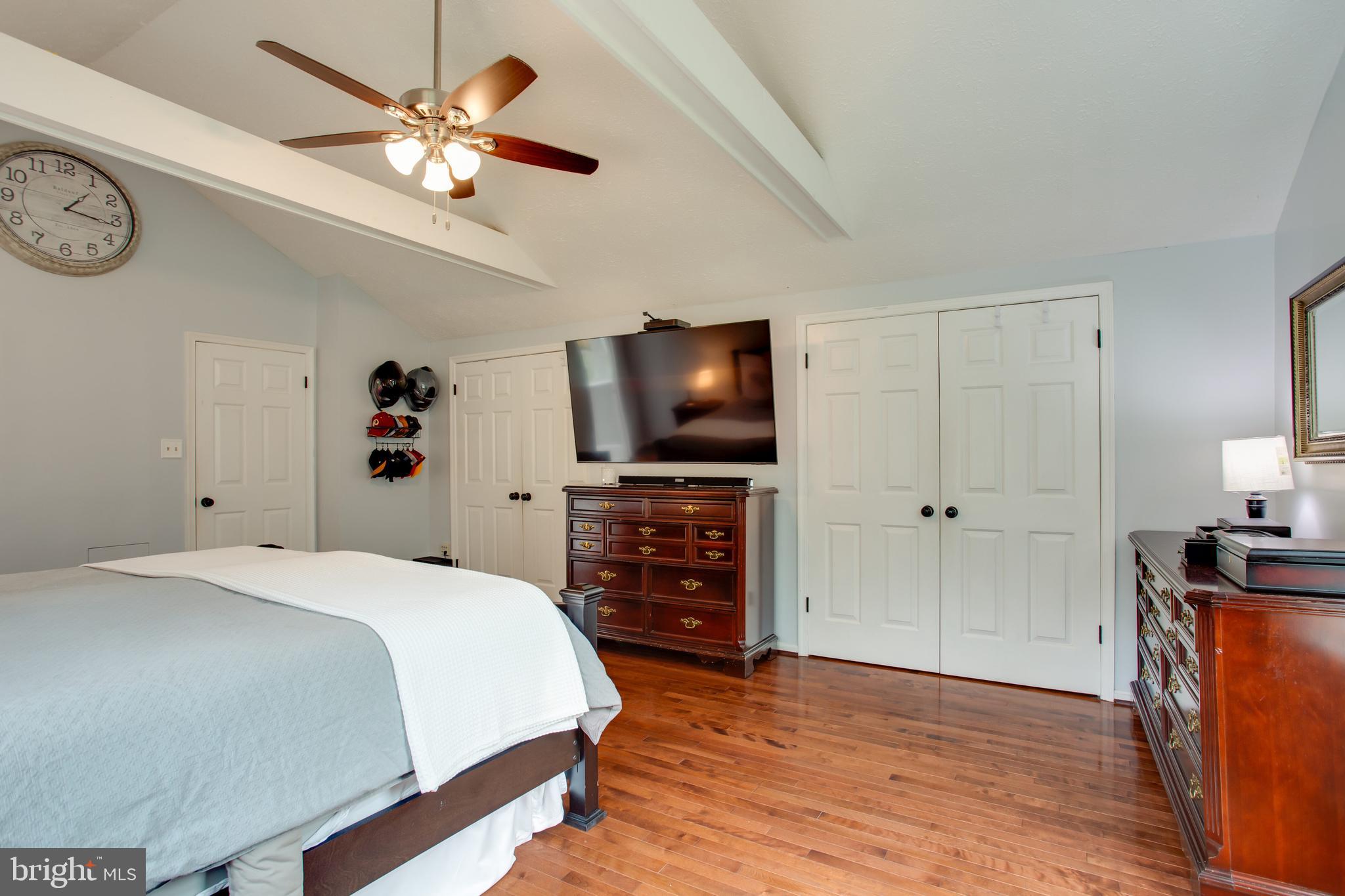 2904 Eutaw Forest Drive Waldorf, MD 20603 - Photo 36 of 59 a spacious bedroom with a bed and a flat screen tv