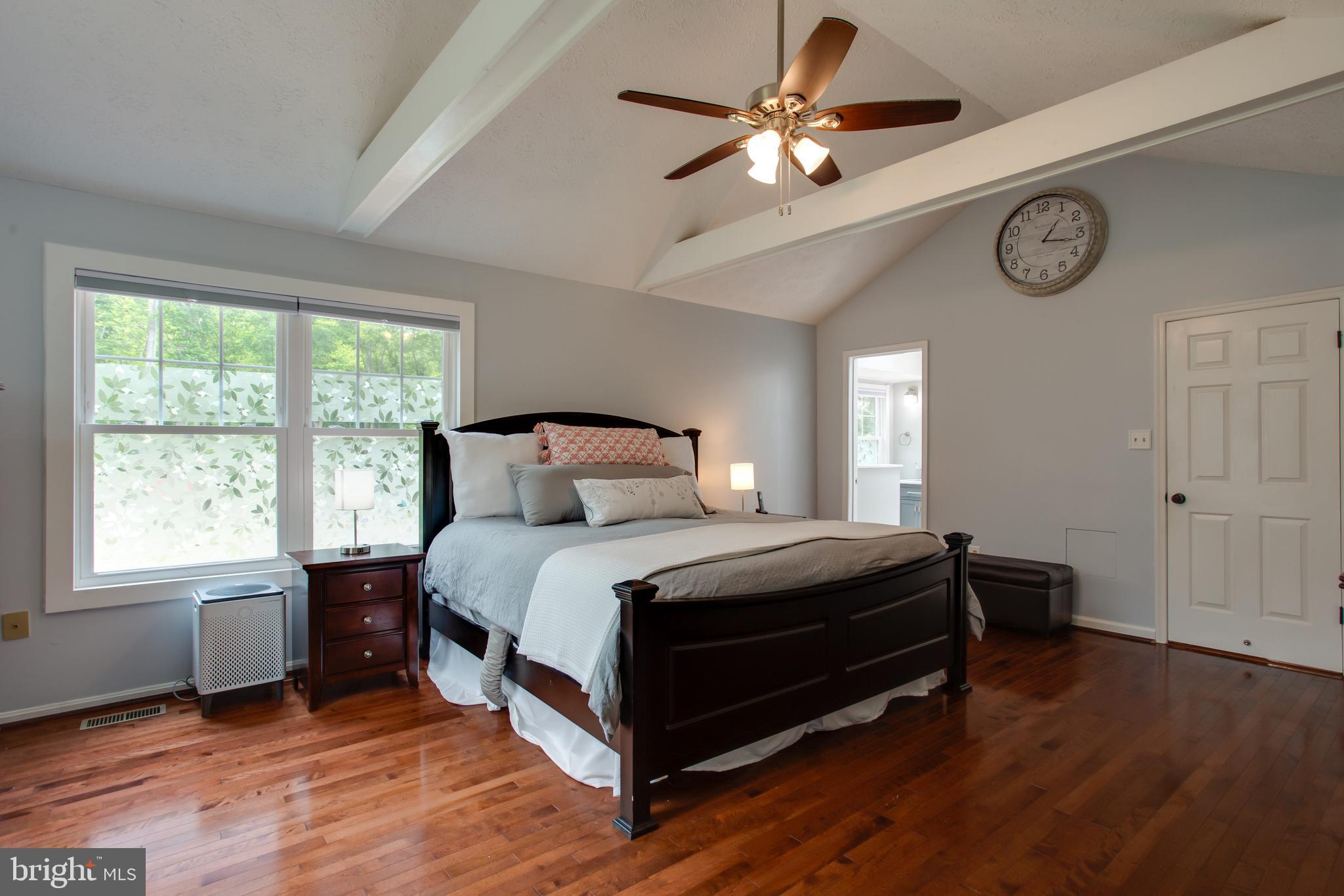 2904 Eutaw Forest Drive Waldorf, MD 20603 - Photo 37 of 59 a bedroom with a bed and a large window with a ceiling fan