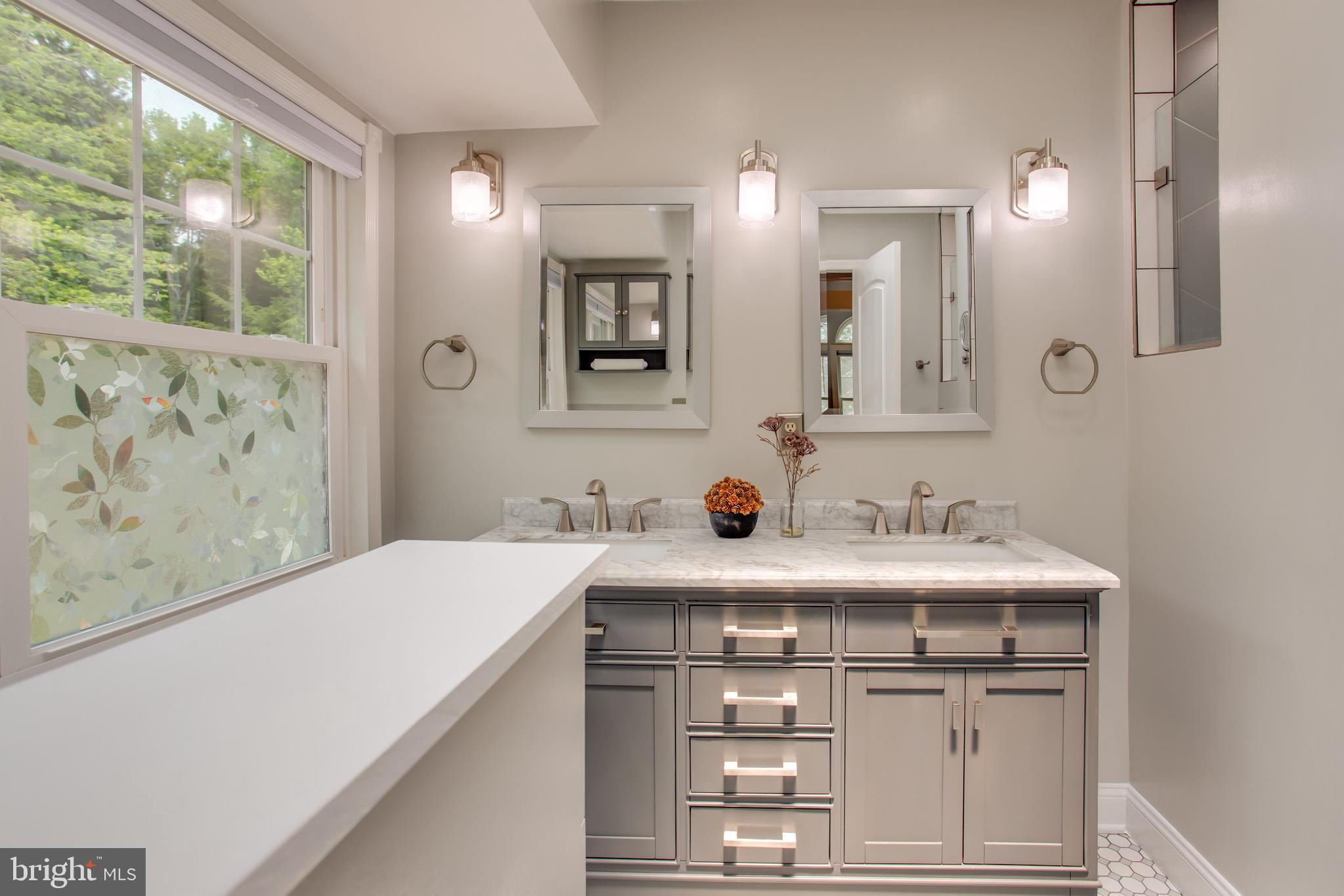 2904 Eutaw Forest Drive Waldorf, MD 20603 - Photo 38 of 59 a bathroom with a sink and a mirror
