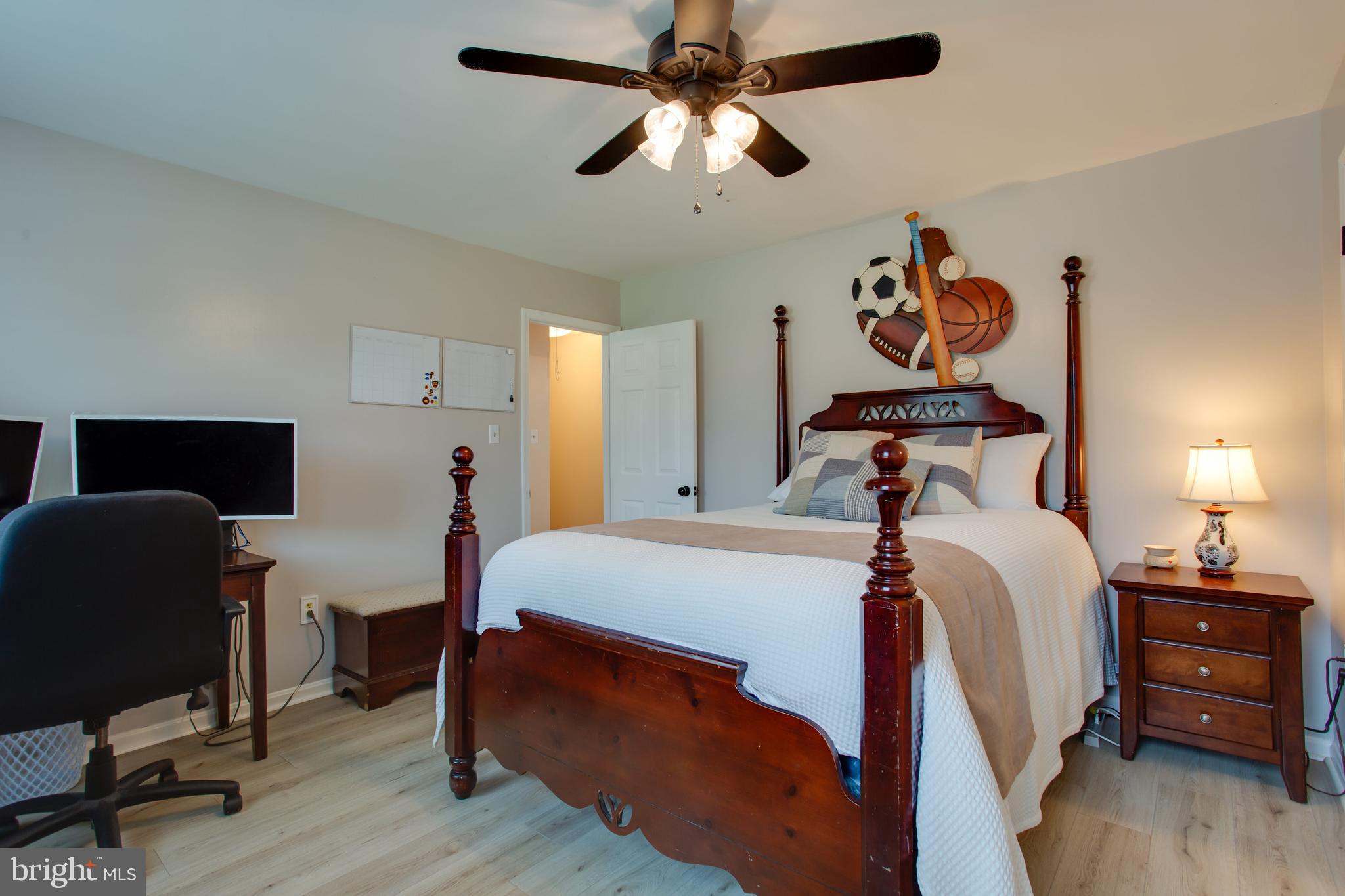 2904 Eutaw Forest Drive Waldorf, MD 20603 - Photo 42 of 59 a bedroom with a bed and a chandelier