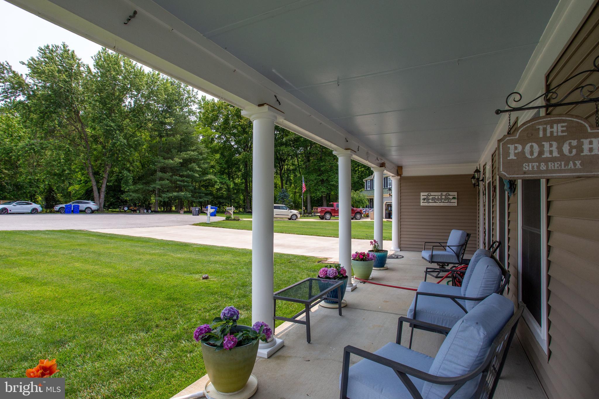 2904 Eutaw Forest Drive Waldorf, MD 20603 - Photo 46 of 59 a view of a patio with couches chairs and potted plants