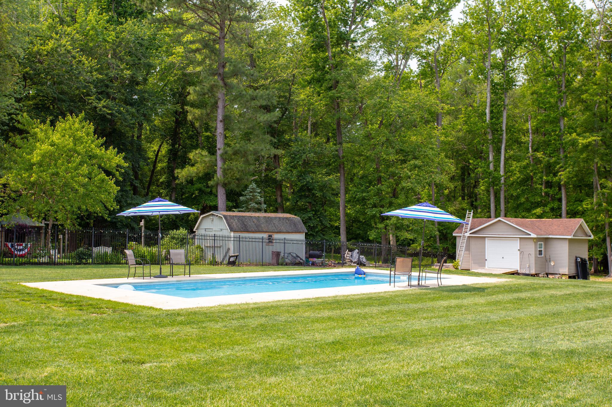 2904 Eutaw Forest Drive Waldorf, MD 20603 - Photo 50 of 59 a swimming pool with outdoor seating and yard
