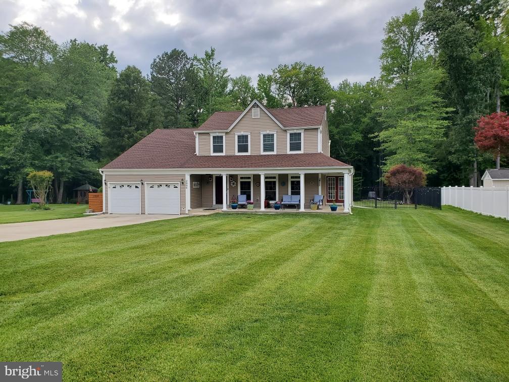2904 Eutaw Forest Drive Waldorf, MD 20603 - Photo 57 of 59 a front view of a house with a yard and trees