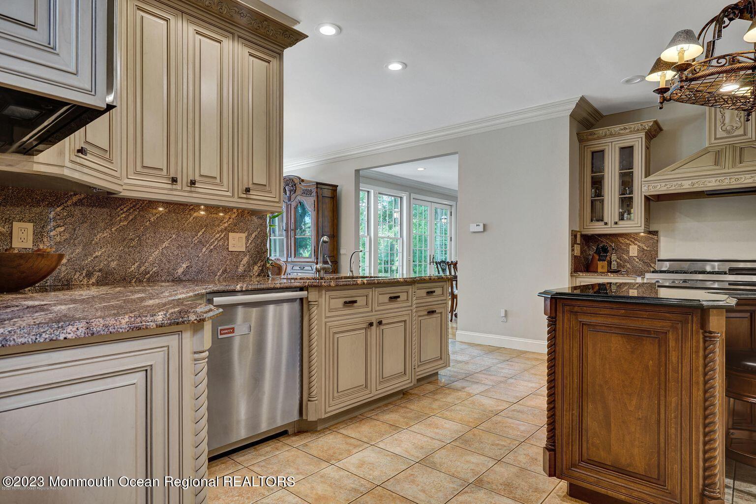 67 Phalanx Road Lincroft, NJ 07738 - Photo 13 of 55 a kitchen with stainless steel appliances granite countertop a sink and cabinets