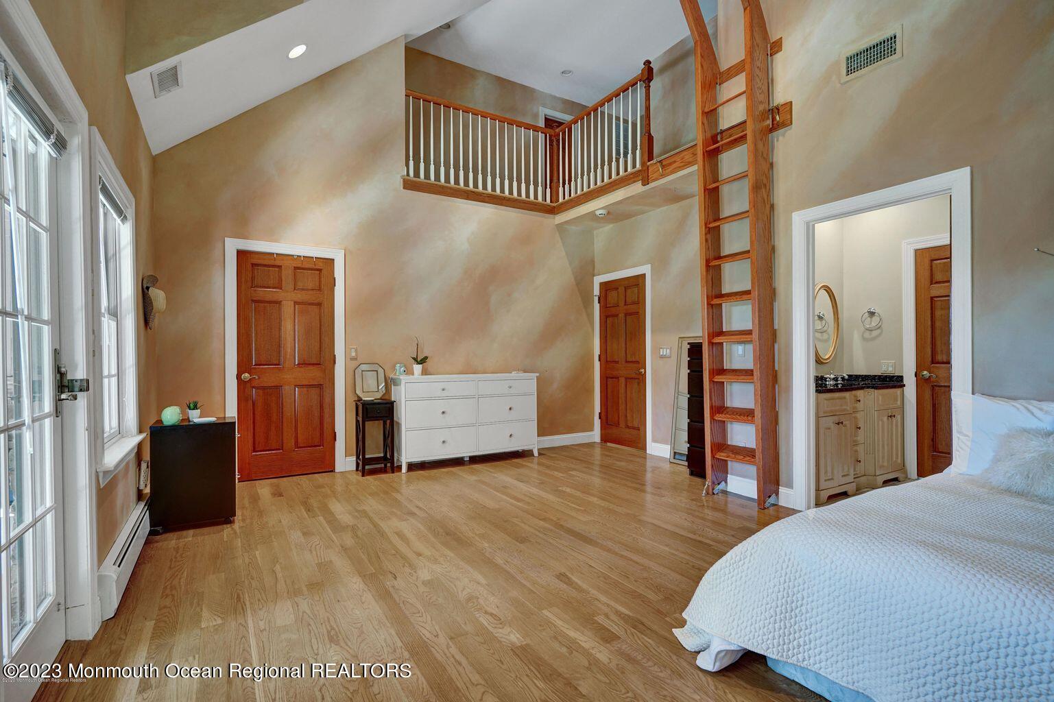 67 Phalanx Road Lincroft, NJ 07738 - Photo 18 of 55 a spacious bedroom with a bed and a cabinets