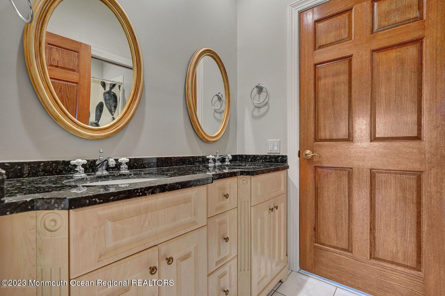 67 Phalanx Road Lincroft, NJ 07738 - Photo 19 of 55 a bathroom with a sink and a mirror