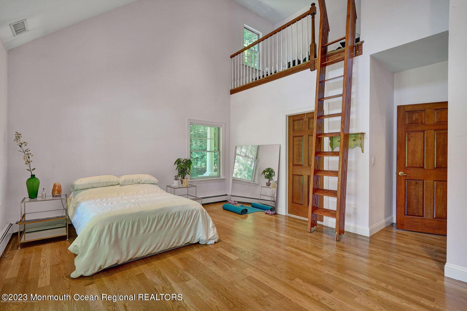 67 Phalanx Road Lincroft, NJ 07738 - Photo 20 of 55 a bedroom with a bed table and a window