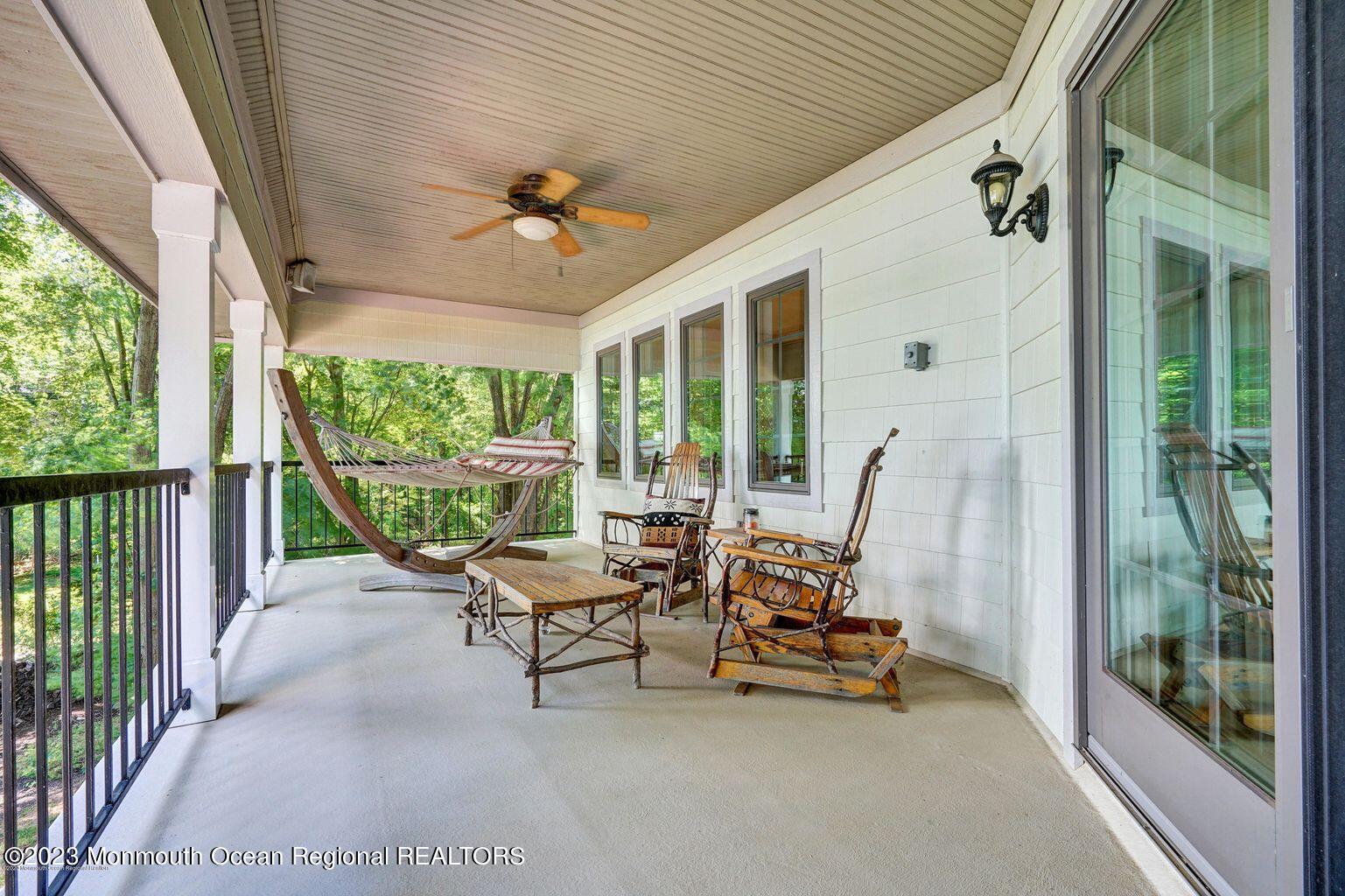 67 Phalanx Road Lincroft, NJ 07738 - Photo 25 of 55 a view of a patio with a table and chairs