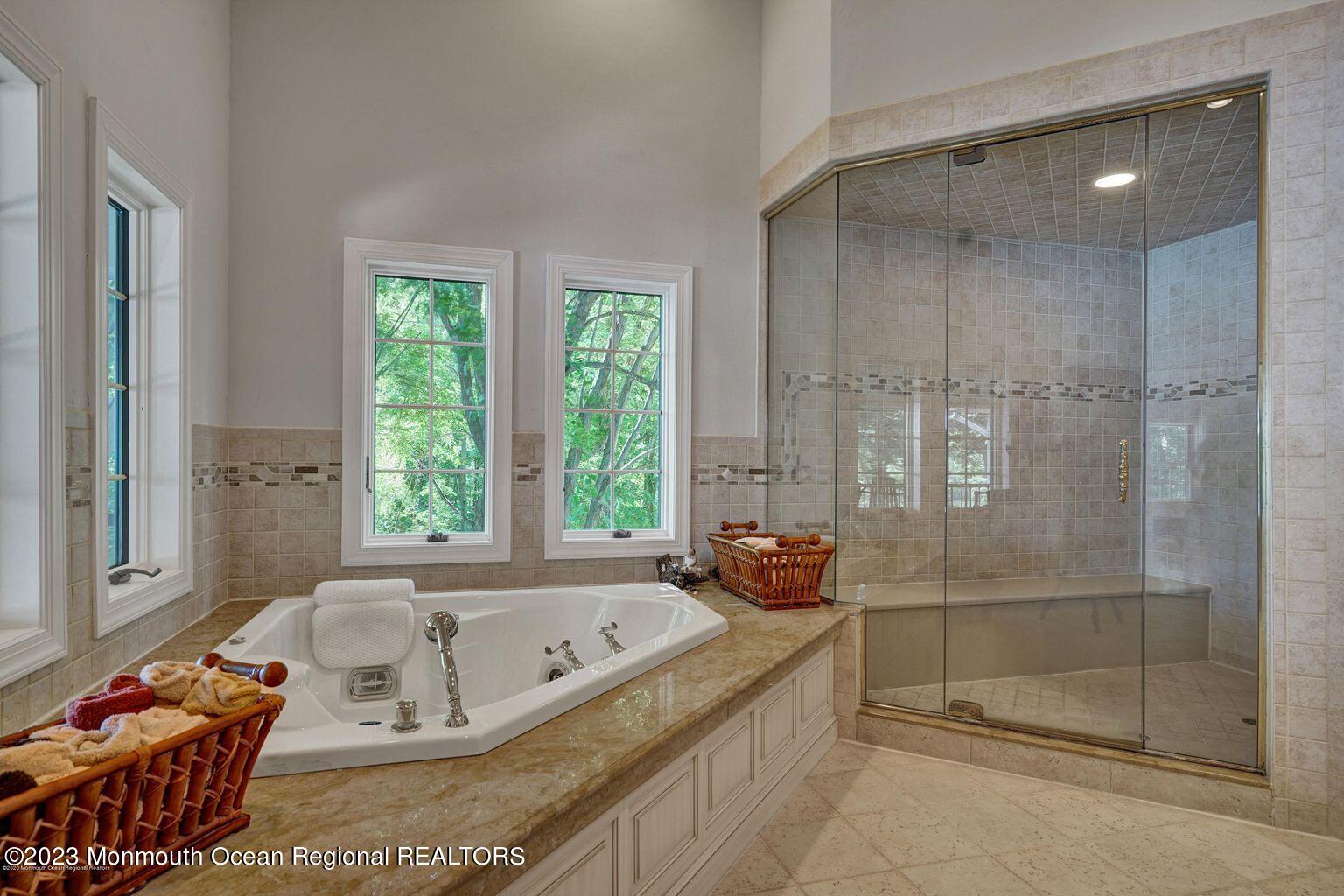 67 Phalanx Road Lincroft, NJ 07738 - Photo 27 of 55 a bath tub sitting in a bathroom next to a window