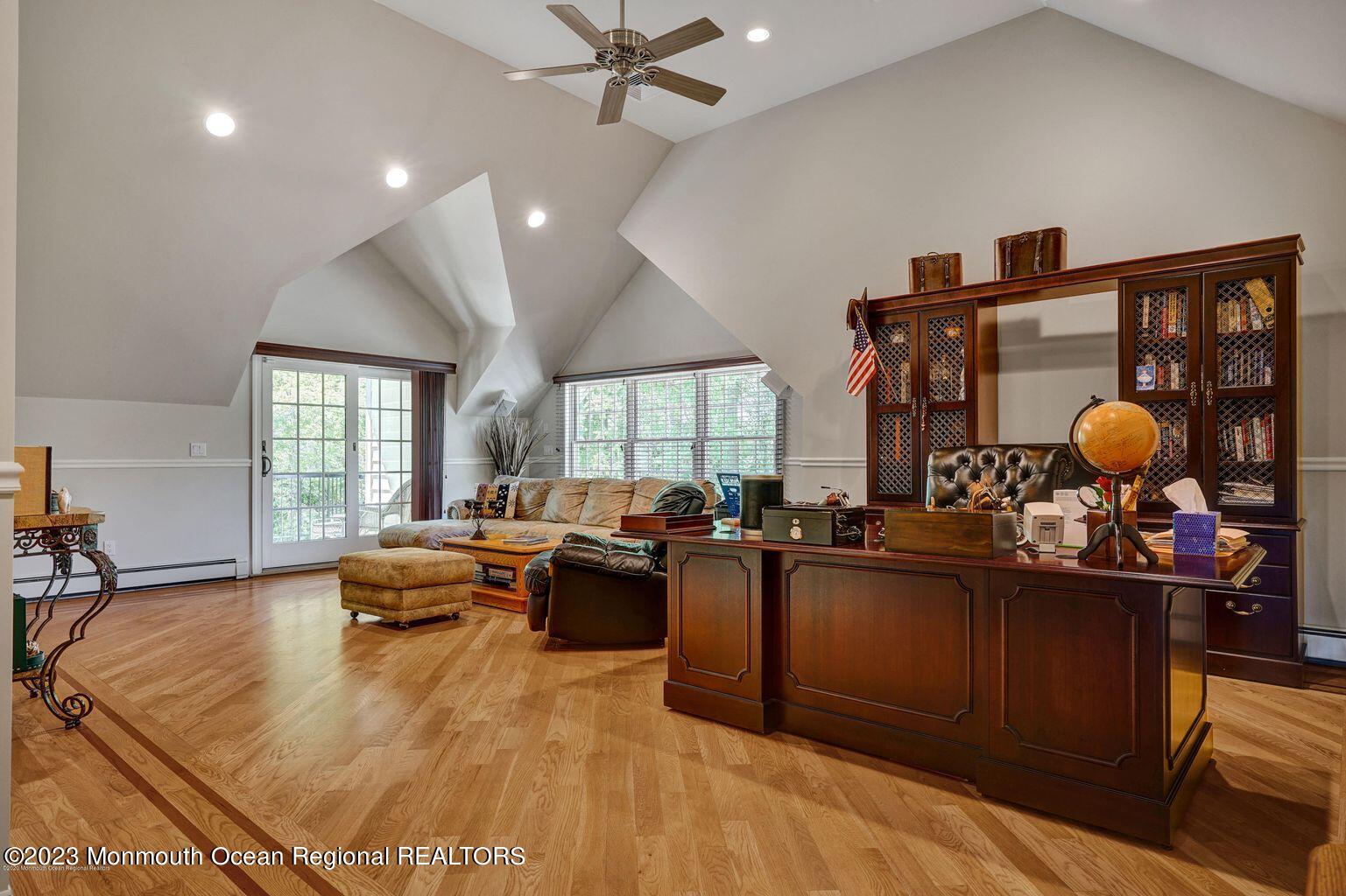 67 Phalanx Road Lincroft, NJ 07738 - Photo 28 of 55 a living room with furniture a window and kitchen view