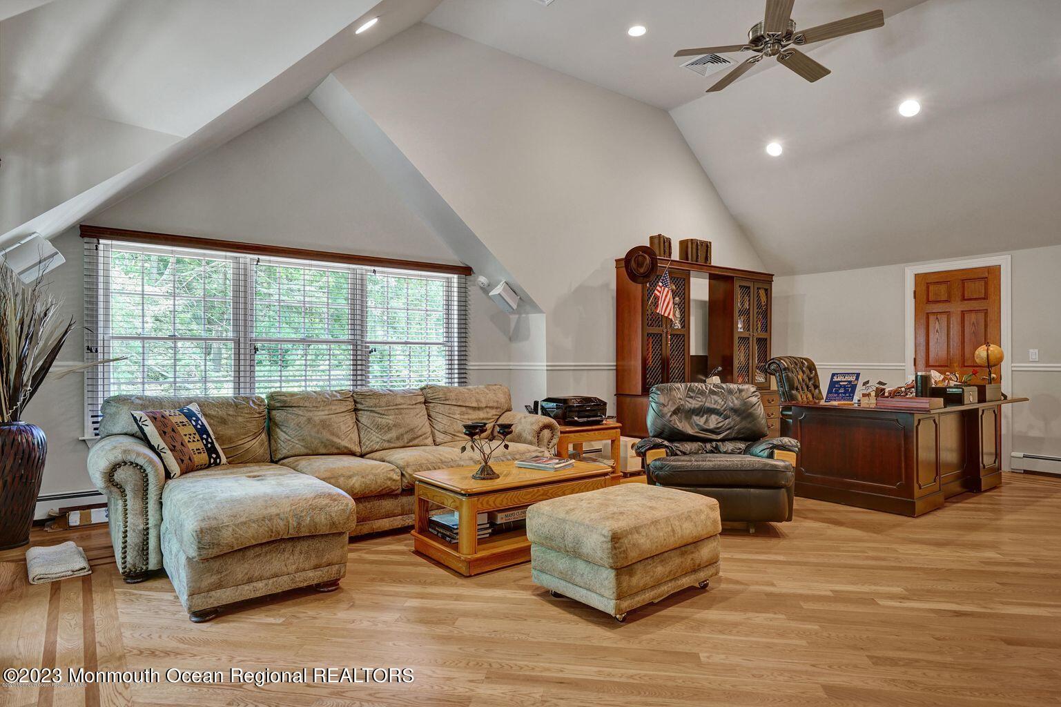 67 Phalanx Road Lincroft, NJ 07738 - Photo 29 of 55 a living room with furniture and a large window