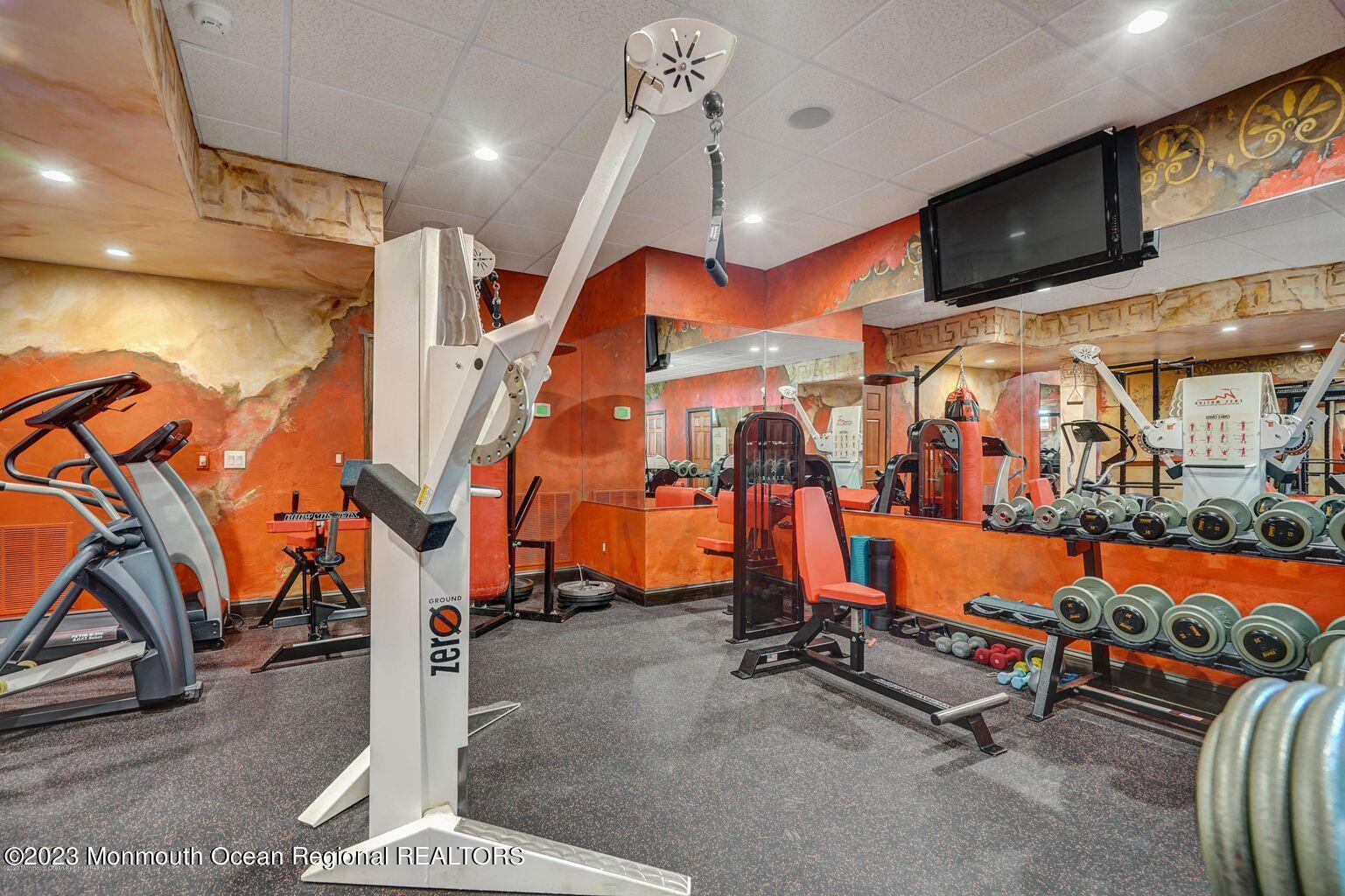 67 Phalanx Road Lincroft, NJ 07738 - Photo 33 of 55 a view of a room with gym equipment
