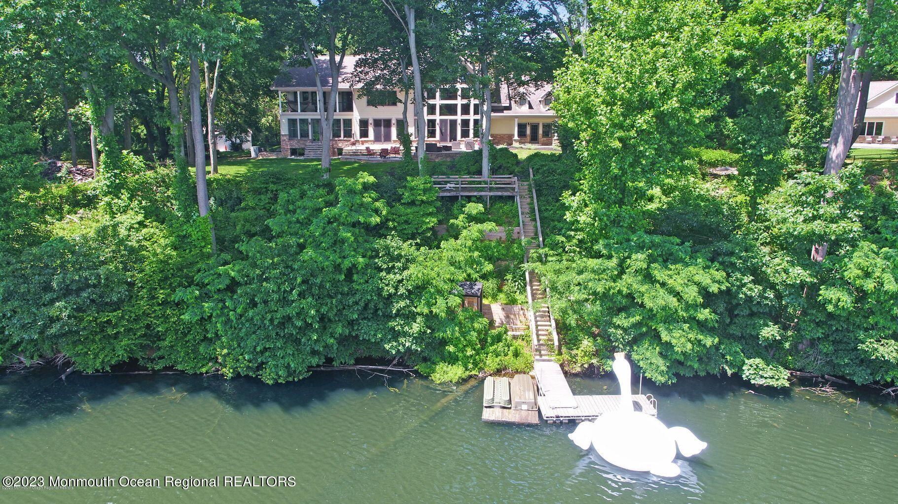 67 Phalanx Road Lincroft, NJ 07738 - Photo 36 of 55 a view of a garden with a bench