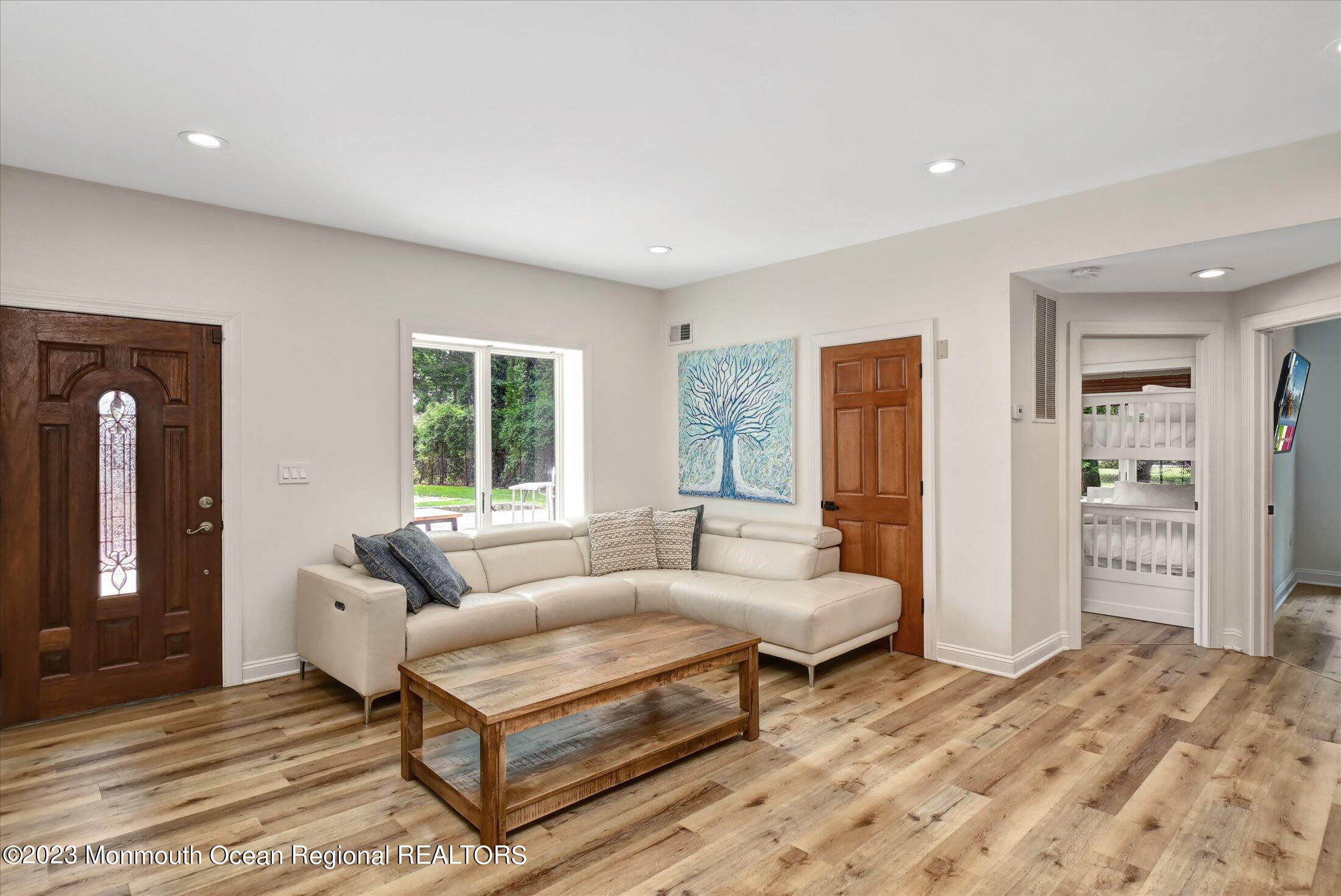 67 Phalanx Road Lincroft, NJ 07738 - Photo 43 of 55 a living room with furniture and window