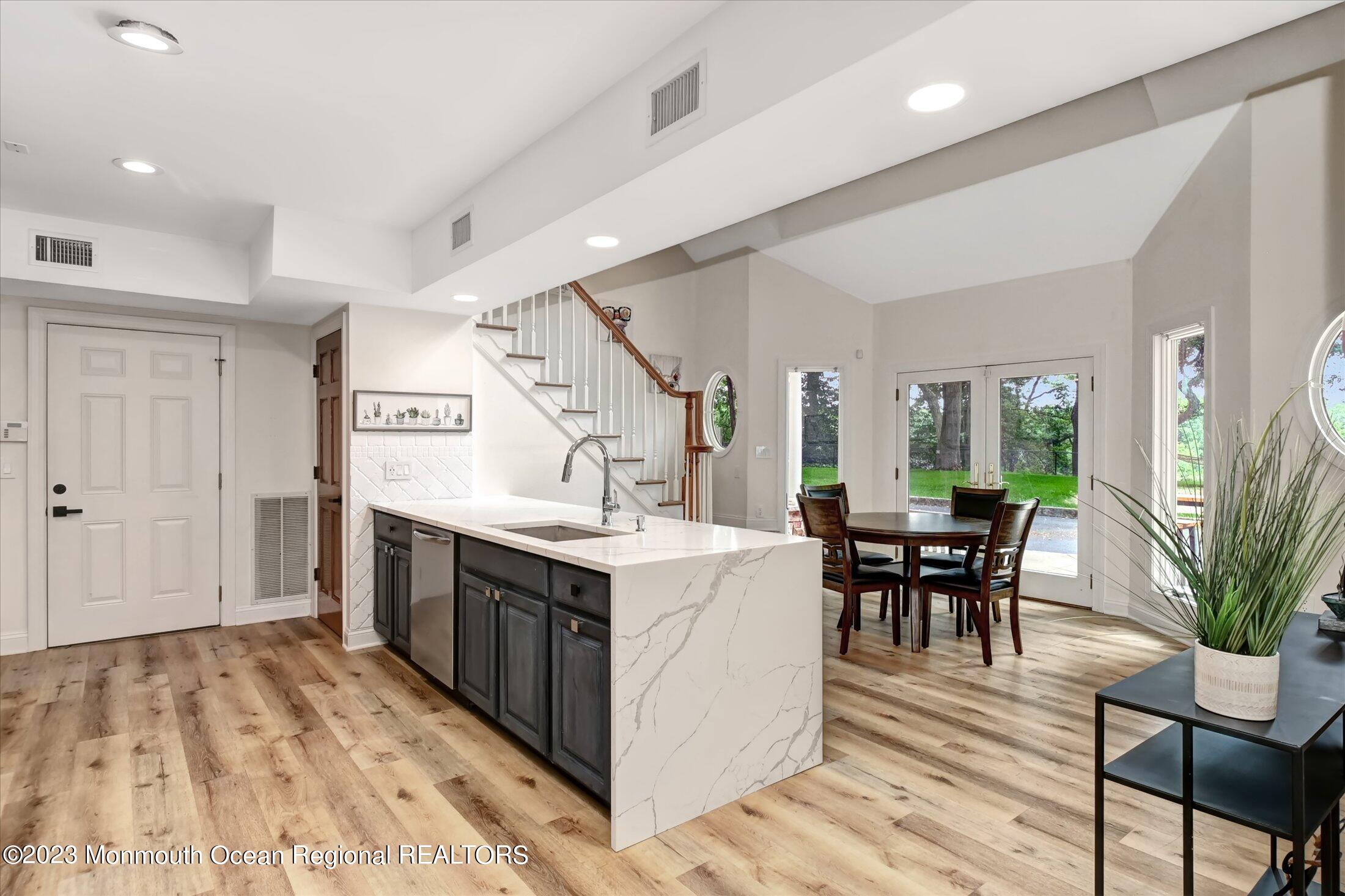 67 Phalanx Road Lincroft, NJ 07738 - Photo 46 of 55 a view of kitchen with cabinets and wooden floor