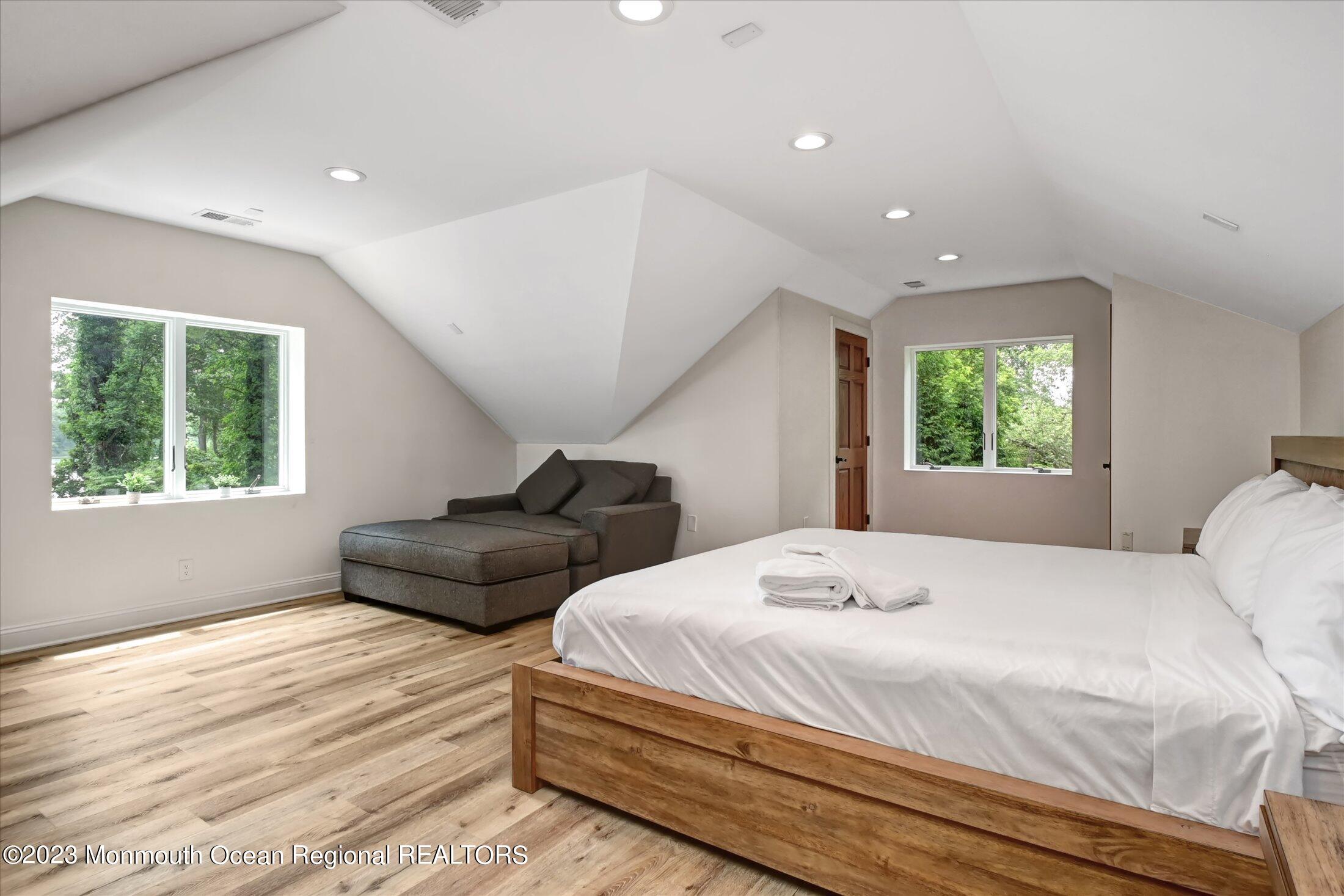 67 Phalanx Road Lincroft, NJ 07738 - Photo 50 of 55 a bedroom with a bed and a large window