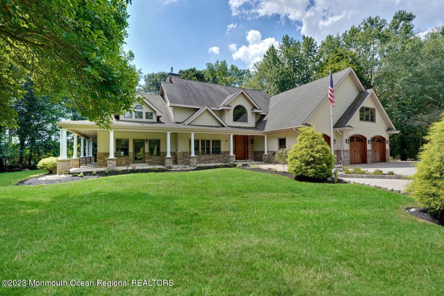 67 Phalanx Road Lincroft, NJ 07738 - Photo 5 of 55 a front view of a house with a yard and green space
