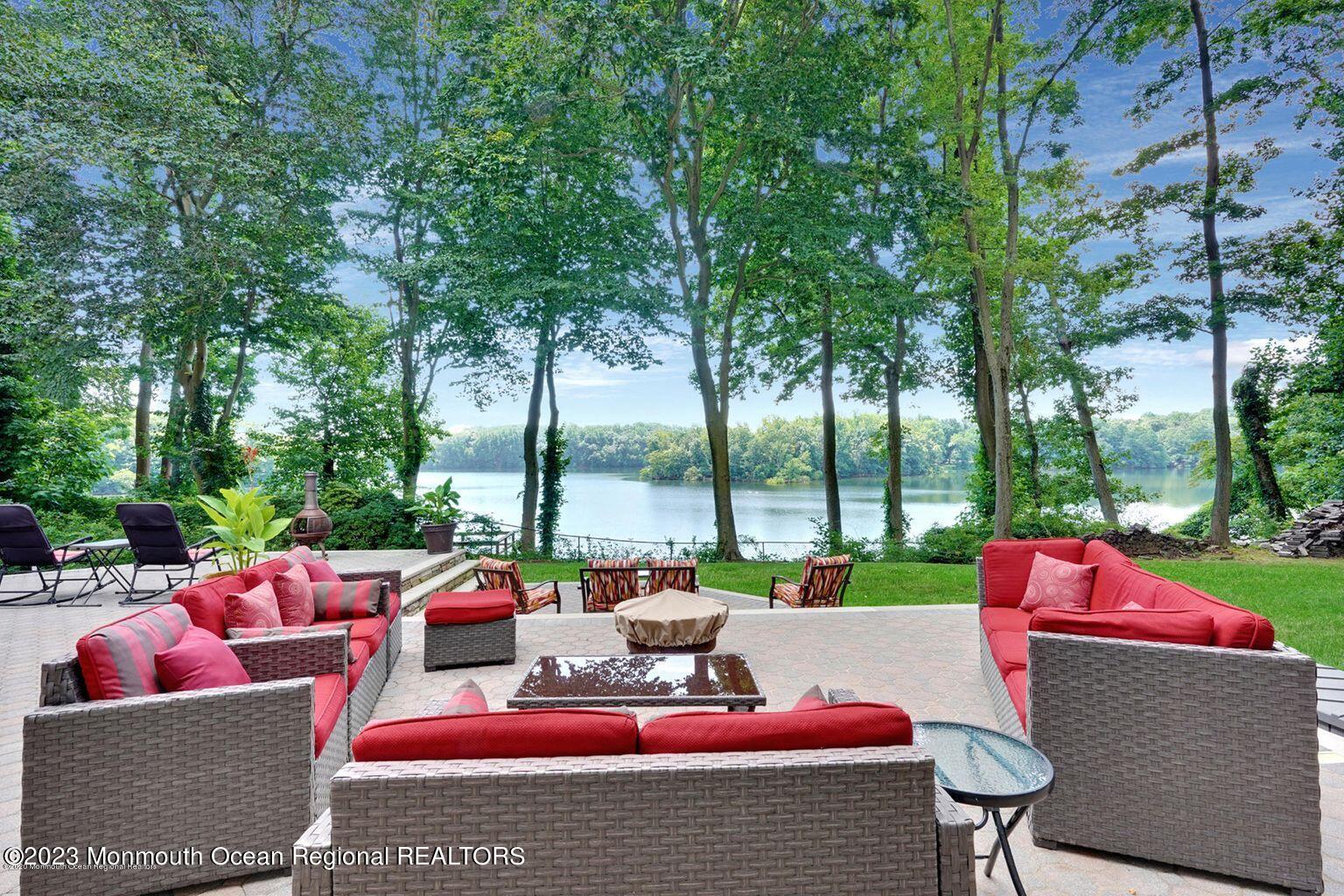 67 Phalanx Road Lincroft, NJ 07738 - Photo 8 of 55 a view of a patio with couches chairs and a potted plant