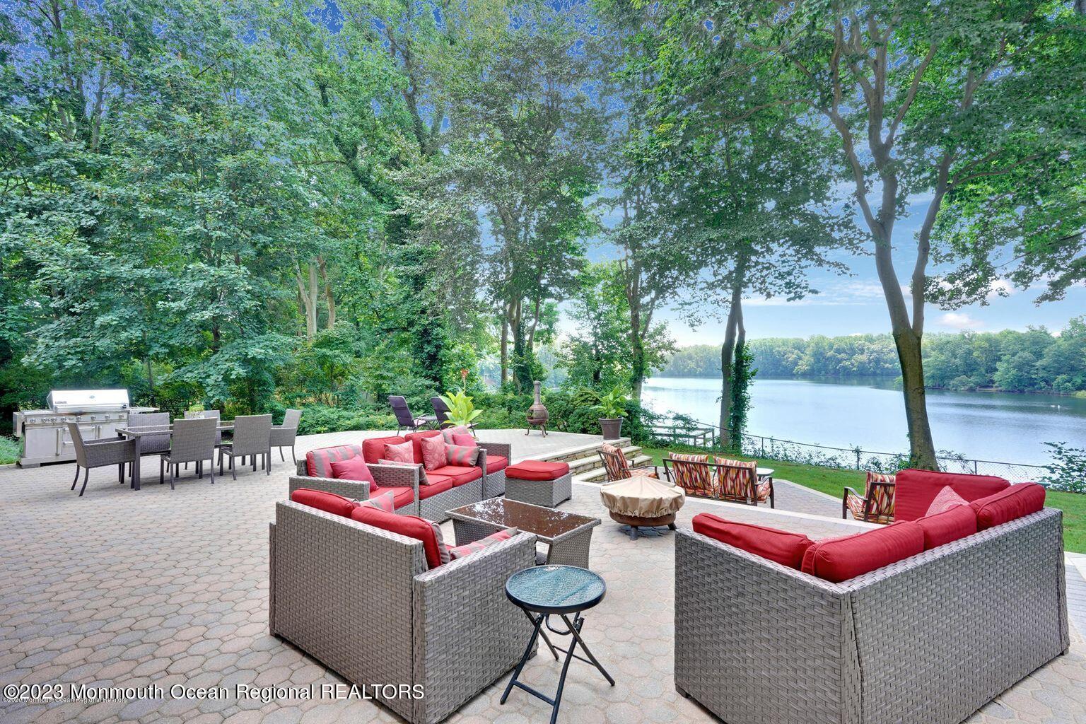 67 Phalanx Road Lincroft, NJ 07738 - Photo 9 of 55 a outdoor living space with furniture and a fire pit