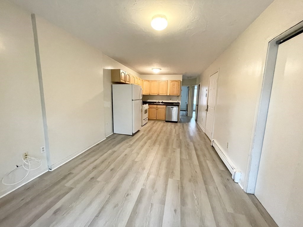 92 Hammond Street, Unit 2 Boston, MA 02120 - Photo 4 of 10 a view of kitchen and wooden floor