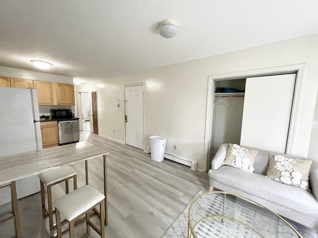 92 Hammond Street, Unit 2 Boston, MA 02120 - Photo 6 of 10 a living room with furniture and a table