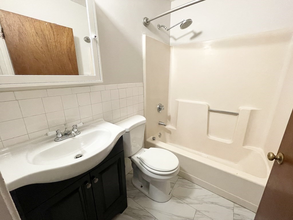 92 Hammond Street, Unit 2 Boston, MA 02120 - Photo 10 of 10 a bathroom with a sink a toilet and shower